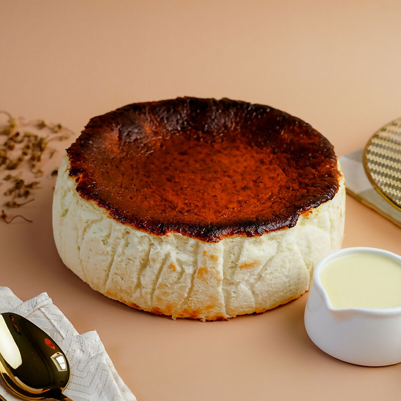 Basque Cheesecake Whole with White Chocolate Sauce 800x800
